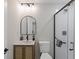 Modern bathroom with a frameless glass shower and wood vanity at 5369 Tuscawilla Dr, Weeki Wachee, FL 34607