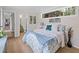 Main bedroom with en-suite bathroom and light and airy decor at 5369 Tuscawilla Dr, Weeki Wachee, FL 34607