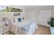 Main bedroom with a large window and en-suite bathroom at 5369 Tuscawilla Dr, Weeki Wachee, FL 34607