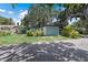 Light teal house exterior with green lawn at 5369 Tuscawilla Dr, Weeki Wachee, FL 34607