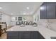 Modern kitchen with breakfast bar and open layout to living area at 5369 Tuscawilla Dr, Weeki Wachee, FL 34607