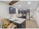 Modern kitchen with dark cabinetry, quartz countertops and breakfast bar at 5369 Tuscawilla Dr, Weeki Wachee, FL 34607