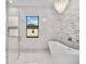 Modern bathroom with a free-standing tub and walk-in shower at 5341 Lake Pearl Ct, Tampa, FL 33625