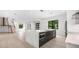 Modern kitchen with marble island, stainless steel appliances, and ample counter space at 5341 Lake Pearl Ct, Tampa, FL 33625