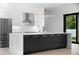 Modern kitchen with marble island, stainless steel appliances, and geometric backsplash at 5341 Lake Pearl Ct, Tampa, FL 33625