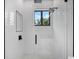 Stylish walk-in shower with modern fixtures and hexagon tile floor at 5341 Lake Pearl Ct, Tampa, FL 33625