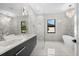 Elegant bathroom featuring a soaking tub, double vanity, and glass shower at 5341 Lake Pearl Ct, Tampa, FL 33625