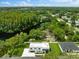 Aerial view of home near lake with lush green surroundings at 5341 Lake Pearl Ct, Tampa, FL 33625