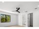 Bedroom with ceiling fan, walk-in closet and en-suite bathroom at 5341 Lake Pearl Ct, Tampa, FL 33625