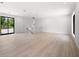 Bright bonus room with hardwood floors and access to balcony at 5341 Lake Pearl Ct, Tampa, FL 33625