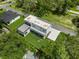Aerial view of a modern home with a large backyard and a patio at 5341 Lake Pearl Ct, Tampa, FL 33625