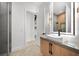Contemporary bathroom featuring a sleek vanity and illuminated mirror at 5341 Lake Pearl Ct, Tampa, FL 33625