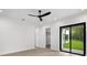 Bright bedroom with sliding glass doors to backyard and walk-in closet at 5341 Lake Pearl Ct, Tampa, FL 33625