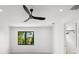 Bedroom with large window, ceiling fan and en-suite bathroom at 5341 Lake Pearl Ct, Tampa, FL 33625