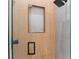 Modern shower with wood-like tile and black accents at 5341 Lake Pearl Ct, Tampa, FL 33625