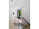 Open bonus room with glass railing overlooking the lower level at 5341 Lake Pearl Ct, Tampa, FL 33625