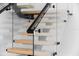 Modern staircase with glass and wood features at 5341 Lake Pearl Ct, Tampa, FL 33625