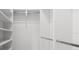 Bright closet with built-in shelves and hanging rod at 5341 Lake Pearl Ct, Tampa, FL 33625