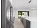 Modern kitchen with stainless steel appliances and access to backyard at 5341 Lake Pearl Ct, Tampa, FL 33625