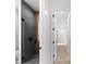 Modern bathroom with a glass shower and gray tile, hallway view at 5341 Lake Pearl Ct, Tampa, FL 33625