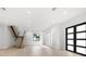 Bright and airy living room with hardwood floors, modern staircase, and large windows at 5341 Lake Pearl Ct, Tampa, FL 33625