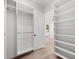 Spacious walk-in closet with ample shelving and hanging rods at 5341 Lake Pearl Ct, Tampa, FL 33625