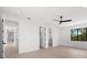 Bright bedroom with wood flooring, ceiling fan and access to hallway at 5341 Lake Pearl Ct, Tampa, FL 33625