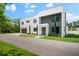 Modern two-story home with attached garage and landscaping at 5341 Lake Pearl Ct, Tampa, FL 33625