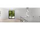 Bonus room features hardwood floors and sliding glass doors to balcony at 5341 Lake Pearl Ct, Tampa, FL 33625