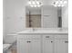 Clean bathroom with double sinks and white cabinets at 11362 Daybreak Gln, Parrish, FL 34219