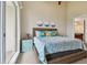 Main bedroom with king bed, balcony access, and coastal decor at 424 Bahia Beach Blvd, Ruskin, FL 33570