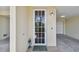 Inviting front door entrance with glass panels and a small welcome mat at 424 Bahia Beach Blvd, Ruskin, FL 33570