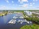 Drone shot of a full marina with many boats and a building in the background at 424 Bahia Beach Blvd, Ruskin, FL 33570