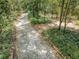 Long private driveway leading through a wooded area at 2271 Keystone Rd, Tarpon Springs, FL 34688