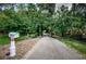 Long private driveway leading to a secluded property at 2271 Keystone Rd, Tarpon Springs, FL 34688