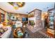 Living area featuring a brick fireplace and ample seating at 2271 Keystone Rd, Tarpon Springs, FL 34688