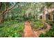 Brick pathway leading to a charming house at 2271 Keystone Rd, Tarpon Springs, FL 34688