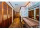 Walk-in closet with wooden doors and vanity at 2271 Keystone Rd, Tarpon Springs, FL 34688