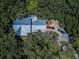 Aerial view showcasing a home's metal roof and driveway at 2271 Keystone Rd, Tarpon Springs, FL 34688