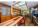 View of kitchen with island, stained glass, and wood cabinets at 2271 Keystone Rd, Tarpon Springs, FL 34688