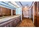 Double vanity bathroom with shower and closets at 2271 Keystone Rd, Tarpon Springs, FL 34688