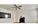 Spacious bedroom with large TV, walk-in closet and hardwood floors at 404 Darcy Bluff Pl, Valrico, FL 33594