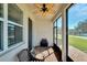 Spacious screened porch with ceiling fan, brick flooring, and outdoor seating at 404 Darcy Bluff Pl, Valrico, FL 33594