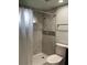 Bathroom shower with tile surround and glass door at 4115 Murfield E Dr, Bradenton, FL 34203