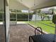 Spacious screened porch overlooking the backyard at 4115 Murfield E Dr, Bradenton, FL 34203