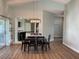 Open concept dining area with hardwood floors and kitchen view at 4115 Murfield E Dr, Bradenton, FL 34203