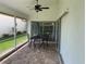 Relaxing screened patio with table and chairs at 4115 Murfield E Dr, Bradenton, FL 34203