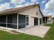 Home features a covered patio and paver stone backyard at 4115 Murfield E Dr, Bradenton, FL 34203