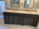 Double vanity bathroom with granite countertops and updated fixtures at 4115 Murfield E Dr, Bradenton, FL 34203