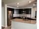Modern kitchen features stainless steel appliances and granite countertops at 4115 Murfield E Dr, Bradenton, FL 34203